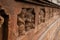 A long frieze of dancing ganas with selective focus, at Badami cave 1,Karnataka,India