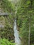 Long gorge with steel trail at rock wall