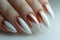 Long Gradient Ombre Acrylic Nails Demonstrated on a Neutral Background