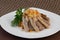 Long-grain rice pilaf with beautifully sliced fat veal garnished