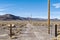 A long gravel driveway off the main road in the Nevada desert, USA