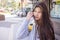 Long hair Asian traveller girl outdoor street shot