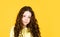 Long hair. Easy hairdo. Beauty supplies. Perfectly untangle curly hair. Pretty girl curly hair yellow background