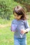 long haired white baby in a gray long sleeve shirt