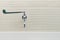 Long-handled Medical Hospital Wall Mounted Faucet on Pale Color Ceramic Wall Background