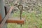 Long iron brown bolt pin in a rusty metal plate