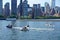 Long Island City, New York: A group of people enjoy a bright summer day riding jet skis in the East River