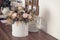 Long lasting flowers decoration. Preserved roses with dried flowers bouquet closeup. Selective focus on home decoration made of