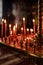 Long lighted candles group in orthodox church. candles background. selective focus