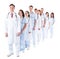 Long line of smiling doctors and nurses