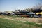 Long line of stacked cars in a scrap yard