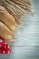 Long loaf wheat ears red tablecloth on white board