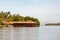 Long low building on a quiet lagoon or shoreline