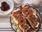 Long molletes for breakfast with a side of refried beans and cheese