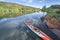Long and narrow racing stand up paddleboard on a calm mountain lake