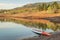 Long and narrow racing stand up paddleboard on a calm mountain lake