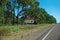 Long Outback Highway With Road Train Route Signage