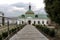 The long path to the church. Gloomy skies over the church.