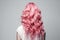 Long Pink Curly Hair , Rear View On White Background. Generative AI
