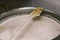 A long plastic stirrer for stirring food in a large pan. Brewing beer. The technology of making beer