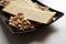 Long potato chips, roasted peeled peanuts, salted beer snacks in black plate