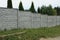 Long private concrete gray fence