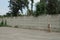 Long private concrete gray fence wall