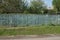 Long private fence of blue from wooden boards
