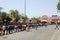 Long queue of Indian migrant laborers outside the railway station waiting to leave the city due to covid-19 pandemic.