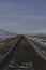 A long rail road in the cold landscape