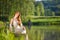 Long red hair romantic woman relax by lake