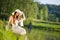 Long red hair romantic woman relax by lake