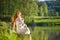 Long red hair romantic woman relax by lake