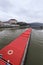 Long red roof of the large river freight boat