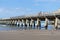 Long repeating pattern and diminishing perspective and shadow of structure underneath Tolaga Bay Wharf, East Coast New Zealand