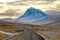 Long road curve in iceland with snow mounrtain background. afternoon time gold cloud