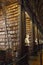 The Long Room interior Of The Old Library At Trinity College. Marble busts of great people and shelves with antique tomes