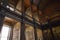 The Long Room interior Of The Old Library At Trinity College. Marble busts of great people and shelves with antique tomes