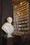 The Long Room interior Of The Old Library At Trinity College. Marble busts of great people and shelves with antique tomes