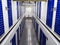 Long row of blue color doors of self storage facility. Service to keep safe extra belongings. Nobody. Selective focus. Clean and