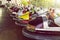 Long row of colorful bumper cars parked in an amusement park