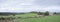Long row of cows in rural landscape of german eifel