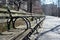 Long Row of Empty Wood Benches at Riverside Park on the Upper West Side of New York City