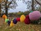 A long row of knitted fruit hanging on a line