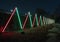 Long row of lighted neon triangles in Lightscape at the Fort Worth Botanic Garden in Texas.