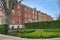 Long row of three story brick townhouses