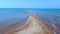 Long sand tropic beach and tranquil turquoise clear Aegean sea. Aerial view