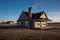 long shadow of a prairie house with central chimney