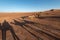 Long shadows from camels in desert