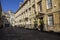 Long shadows cast on alleyway in courtyard